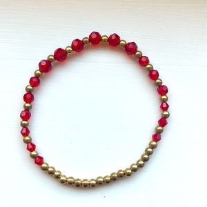 This is a beautiful, red and gold stretchy bracelet
